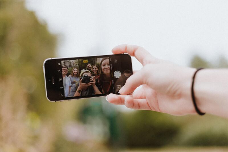 Apple has won a patent to create technology to allow for socially distanced group selfies. Unsplash 