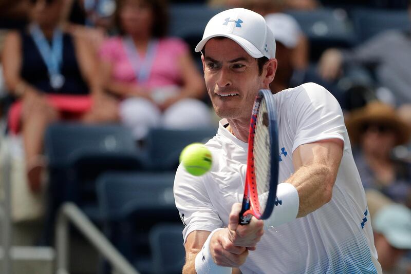 FILE - In this Aug. 27, 2018, file photo, Andy Murray, of Britain, returns a shot to James Duckworth, of Australia, during the first round of the U.S. Open tennis tournament in New York. Three-time major champion Murray is planning to return from hip surgery by competing in doubles at the Queen's Club tournament this month. (AP Photo/Andres Kudacki, File)