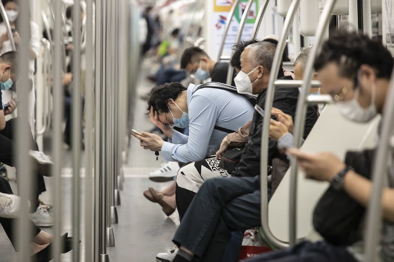 Commuters on a train. Bloomberg