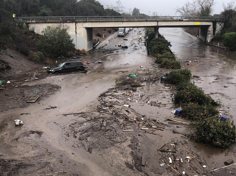 Santa Barbara County Fire Departments shows the US 101 Freeway at the Olive Mill Road overpass flooded with runoff water from Montecito Creek and blocked with mudflow and debris following heavy rains in Montecito, California. Mike Eliason / Santa Barbara County Fire / EPA