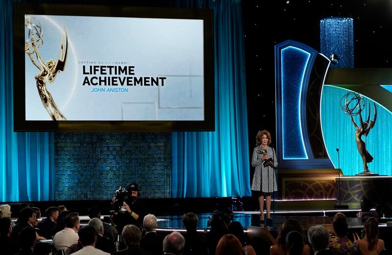 Suzanne Rogers presents the lifetime achievement award to John Aniston at the Daytime Emmy Awards on June 24, 2022, in Pasadena, California. AP