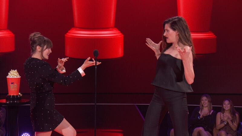 Elizabeth Olsen and Kathryn Hahn react while accepting the Best Fight award for WandaVision during the 2021 MTV Movie & TV Awards in Los Angeles, California, U.S. May 16, 2021. Viacom/Handout via REUTERS ATTENTION EDITORS - NO RESALES. NO ARCHIVES. THIS IMAGE HAS BEEN SUPPLIED BY A THIRD PARTY. NO NEW USES AFTER JULY 15, 2021.