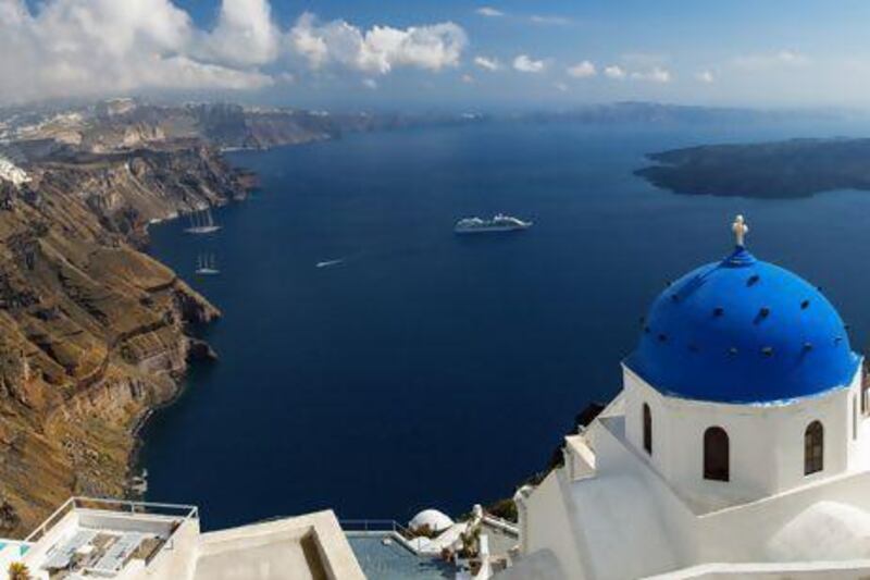 The island of Santorini is known for its beautiful sunsets out over the dramatic caldera. Sylvain Sonnet / Corbis