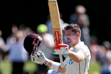New Zealand's Henry Nicholls celebrates reaching his century (100 runs) during the day two of the first cricket Test match between New Zealand and South Africa at Hagley Oval in Christchurch on February 18, 2022.  (Photo by Marty MELVILLE  /  AFP)