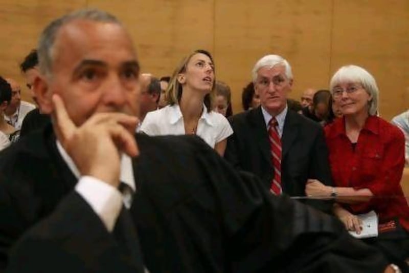 The Corrie family lawyer, Hussein Abu Hussein, sits in the foreground as Rachel's sister Sarah, father Craig and mother Cindy await a verdict over her death in Israel's Haifa District Court.