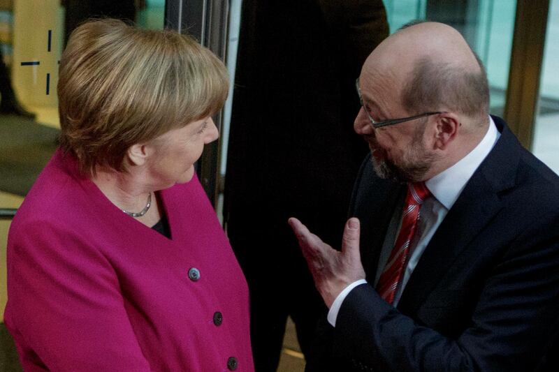 BERLIN, GERMANY - JANUARY 07:  Martin Schulz (R), head of the German Social Democrats (SPD), welcomes German Chancellor and head of the German Christian Democratic Union (CDU) Angela Merkel after the arrival at the headquarters of the German Social Democrats (SPD) for preliminary coalition negotiations on January 7, 2017 in Berlin, Germany. The leaders of the CDU, the SPD and the Bavarian Christian Social Union (CSU) are holding preliminary talks in order to ascertain whether coalition negotiations towards the creation of a government will be possible. Previous talks between the CDU, CSU, the German Free Democrats (FDP) and the German Greens Party collapsed in failure last November. (Photo by Carsten Koall/Getty Images)