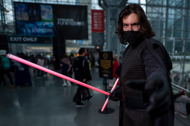 A cosplayer as Kylo Ren poses during the New York Comic Con. Charles Sykes / Invision / AP