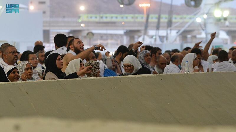 Pilgrims throw stones as part of the ritual. SPA