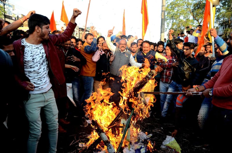 epa06470996 Indian Rajput community members protest and burn the effigy of Sanjay Leela Bhansali, the director of  Bollywood movie 'Padmavat', against the film's release, in Bhopal, India, 24 January 2018. According to media reports, the movie featuring Indian actress Deepika Padukone, Shahid Kapoor, and Ranveer Singh, is set for release on 25 January 2018, after the Central Board of Film Certification (CBFC) clearance. The movie is facing protest by Rajput groups in several states of India, with protesters claiming historical inaccuracies and called for the film to be banned. The period epic tells the story of a 14th century Hindu queen who belonged to the Rajput caste and Muslim ruler Alauddin Khilji. Protestors held various placards some of them read 'India will not tolerate insult of an Indian woman', 'In honor Rani Padmavati Jawar (self immolation), Integrated Nationalist Party in the field', and 'Fight is not of caste and religion, its for the virtuous women' in Hindi.  EPA/SANJEEV GUPTA