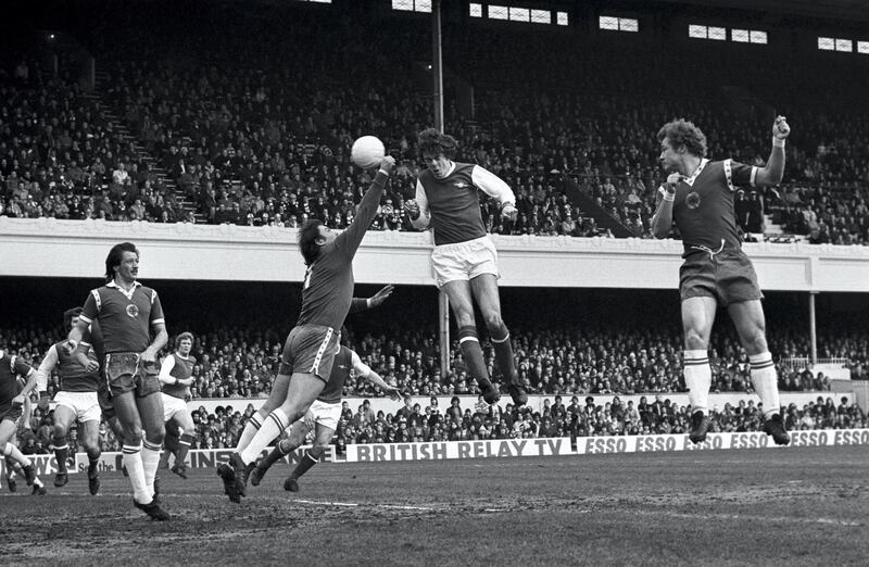 Arsenal's David O'Leary heads the ball over a diving Mark Wallington to score his first goal and his team's second in a 3-0 win over Leicester City.  (Photo by S&G/PA Images via Getty Images)