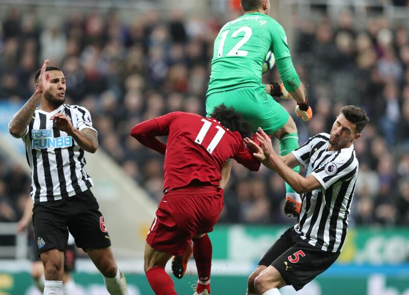 Salah sustains an injury after clashing with Newcastle United's Martin Dubravka. Scott Heppell / Reuters