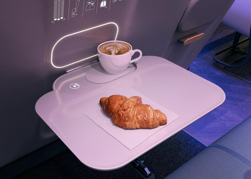 Seat-back trays would become a thing of the past, replaced instead with clip-on meal trays. Courtesy PriestmanGoode