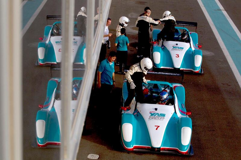 Abu Dhabi, United Arab Emirates, May 27, 2013:    People get into a Supersport SST while taking part in a passenger hot-lap experience during a corporate open day at the Yas Marina Circuit in Abu Dhabi on May 27, 2013. Christopher Pike / The National\

