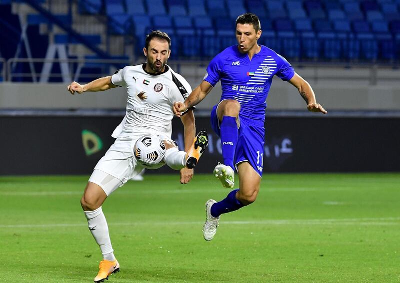 Al Nasr’s Sebastian Tagliabue, right, vies for the ball with Al  Jazira defender Milos Kosanovic. Courtesy PLC