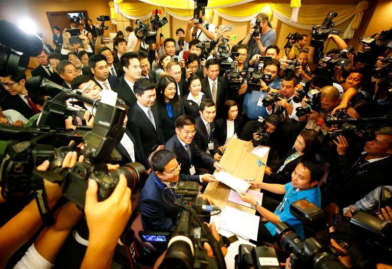 Thai Raksa Chart Party leader Preechapol Pongpanich (submits the election registration form to an officer at the Election Commission in Bangkok. The party nominated Princess Ubolratana Mahidol, elder sister of King Maha Vajiralongkorn, as prime minister candidate for the upcoming general election.  EPA