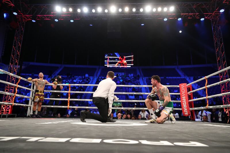 The referee gives Tyrone McKenna a count after Regis Prograis put him on the canvas in the second round.
