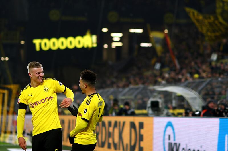 DORTMUND, GERMANY - JANUARY 24: Erling Haland of Borussia Dortmund celebrates scoring his second goal of the game with team mate Jadon Sancho during the Bundesliga match between Borussia Dortmund and 1. FC Koeln at Signal Iduna Park on January 24, 2020 in Dortmund, Germany. (Photo by Dean Mouhtaropoulos/Bongarts/Getty Images)