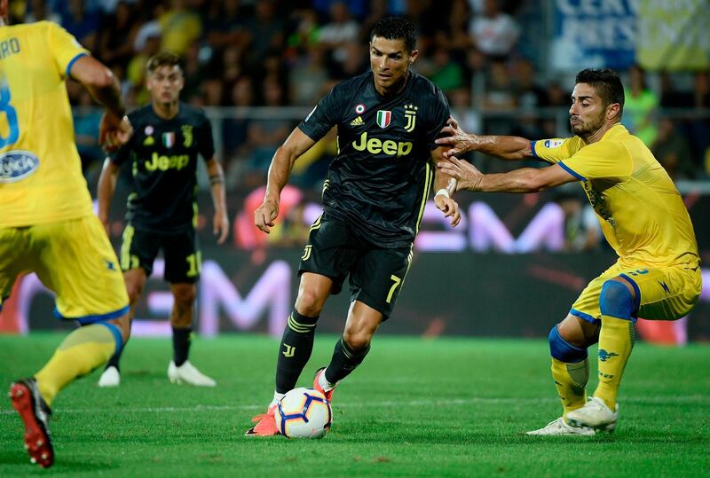 Cristiano Ronaldo takes on Frosinone defender Marco Capuano. AFP