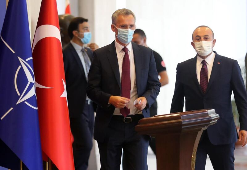 NATO Secretary-General Jens Stoltenberg (C) and Turkey's Foreign Minister Mevlut Cavusoglu (R) arrive for a press conference after their meeting at the Foreign Ministry building in Ankara, on October 05, 2020.
  / AFP / Adem ALTAN

