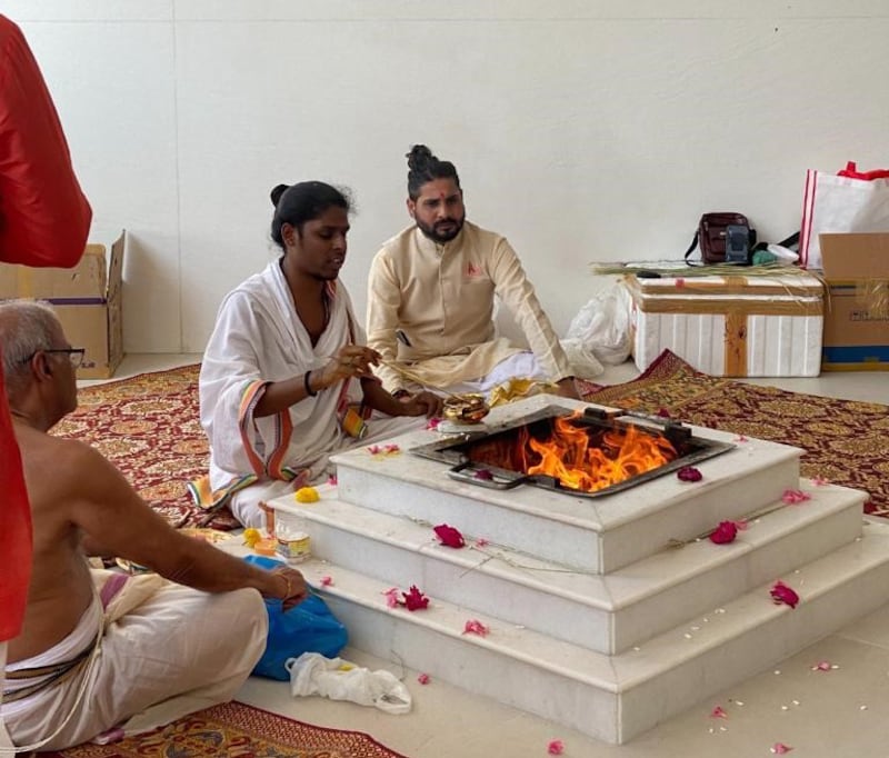 Srinivasan Ramanujam (extreme left) marks his 80th birthday with a prayer ceremony at the Hindu temple in Jebel Ali, Dubai. 
The family invited about 50 guests to mark their father’s  birthday at the temple. Photo: Srinivasan family 
