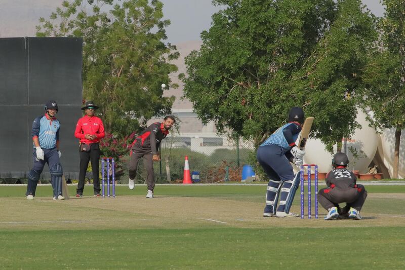 UAE's Rohan Mustafa bowls during the Cricket World Cup League Two match against Namibia at the Oman Cricket Academy ground in Al Amerat. Courtesy Oman Cricket