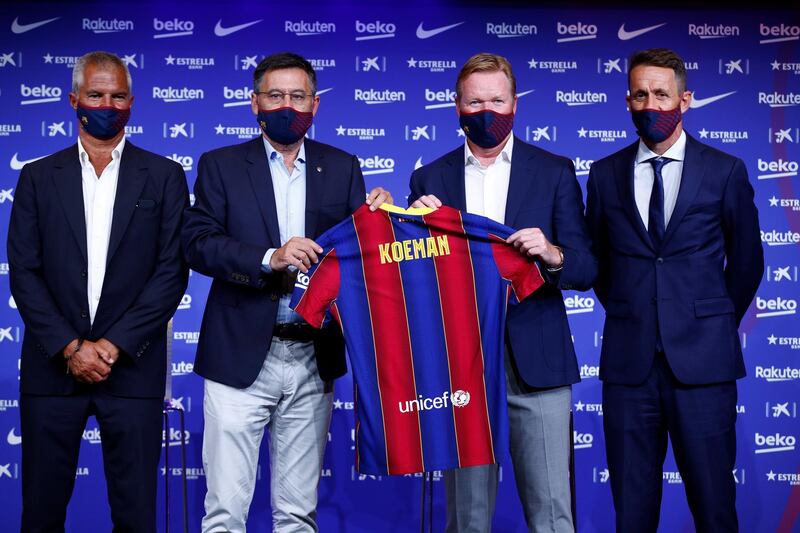 Ronald Koeman, second right, poses next to Barcelona president, Josep Maria Bartomeu, second left, technical secretary Ramon Planas, right, and the club's executive Javier Bordas. EPA