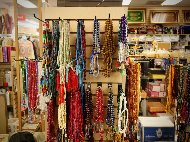 Prayer beads hang at Al Anwar Islamic Fashion shop. Photo: Steve LaBate