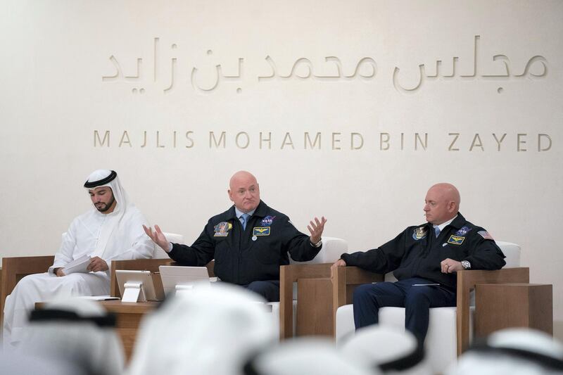 ABU DHABI, UNITED ARAB EMIRATES - June 04, 2018: Captain Mark Kelly (R) and Scott Kelly (C), present a lecture titled, ’The Sky is not the Limit: Life Lessons from NASA’s Kelly Brothers’, at Majlis Mohamed bin Zayed.

( Hamad Al Kaabi / Crown Prince Court - Abu Dhabi )
---