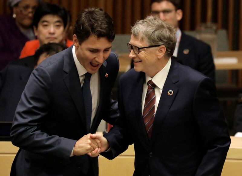 Canadian Prime Minister Justin Trudeau, left, shakes hands with Microsoft founder Bill Gates at the High-level Meeting on Financing the 2030 Agenda for Sustainable Development.  EPA