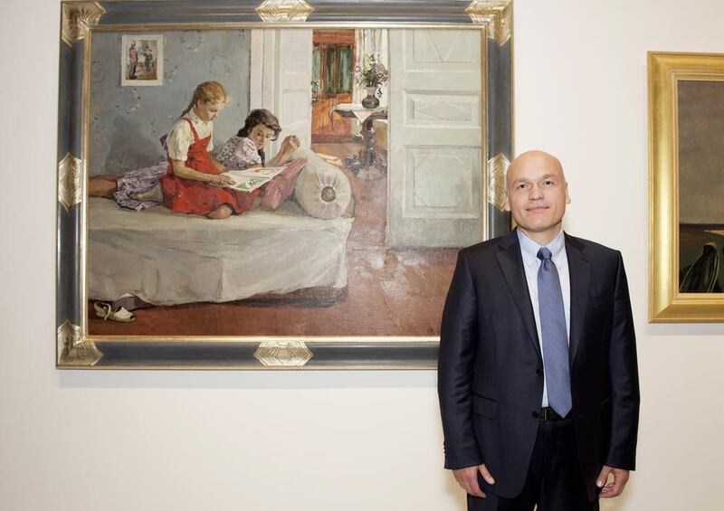 Collector Andrey Filatov stands beside  Tatyana Kopnina’s Girls on display at Emirates Palace. Vidhyaa for The National