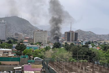 Smoke rises from the site of a car bombing in Kabul. Hikmat Noori and Ruchi Kumar for The National