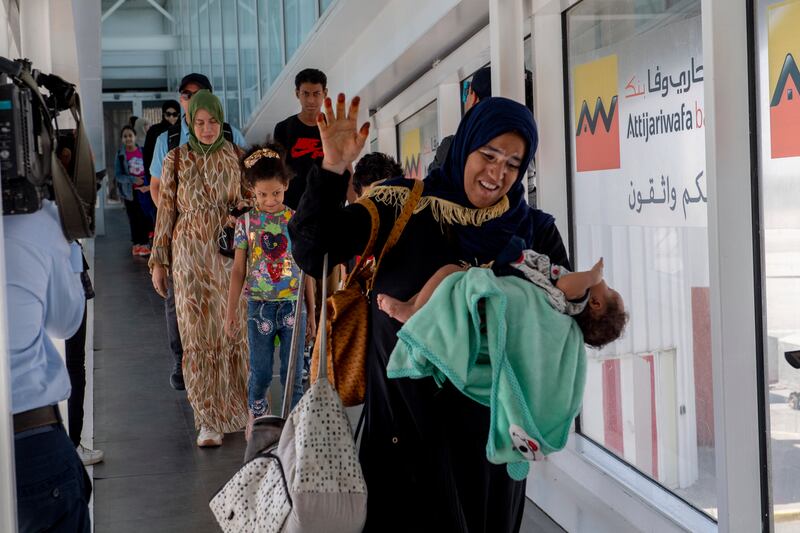 Moroccan nationals, who have been evacuated from Sudan, arrive at Mohammed V airport in Casablanca, Morocco. EPA