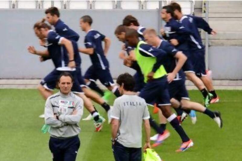 Cesare Prandelli, bottom left, watches his Italy players take part in a training session yesterday in Krakow, Poland. Geert Vanden Wijngaert / AP Photo