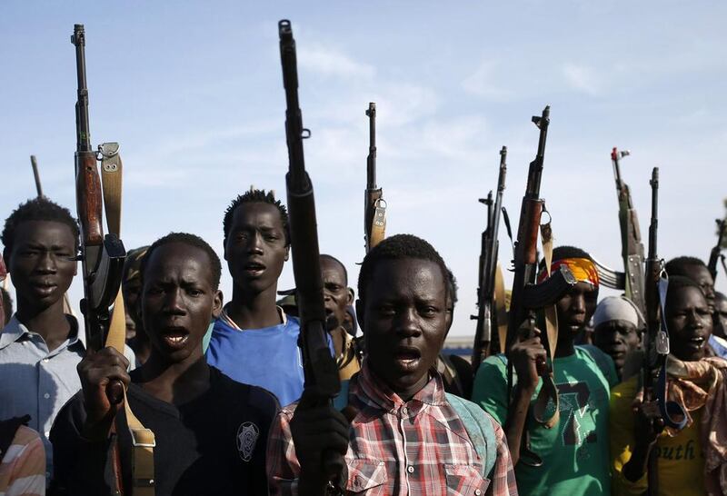 Jikany Nuer White Army fighters brandish their weapons in Upper Nile State on February 10, 2014. South Sudan has been in turmoil since December 15, 2013, when a dispute within the army sparked fierce fighting in the capital city, Juba. Fighting spread quickly across the country and soon took on an ethnic dimension after president Salva Kiir alleged that his former vice-president, Riek Machar, was planning a coup. The fighting has pitted army forces loyal to Kiir, who is a member of the Dinka tribe, against rebel forces aligned to Machar, a member of the Nuer tribe. The Dinka tribe is the largest in South Sudan; the Nuer is the second largest and boasts a deadly tribal militia known as the ‘White Army’ because its fighters rub white ash, extracted from burnt cow dung, over their bodies. The White Army’s main role in the community historically has been to raid cattle and protect the community, but recently it has transformed into a militia used for political gain. The White Army is allegedly responsible for a January 27, 2014, attack — four days after a ceasefire was signed — that left at least 15 people dead. Goran Tomasevic / Reuters