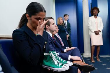 Camila Alves McConaughey holds the lime green Converse tennis shoes that were worn by Uvalde shooting victim Maite Yuleana Rodriguez, 10, as Matthew McConaughey, a native of Uvalde, Texas, joins White House press secretary Karine Jean-Pierre for the daily briefing at the White House in Washington, Tuesday, June 7, 2022.  (AP Photo / Susan Walsh)