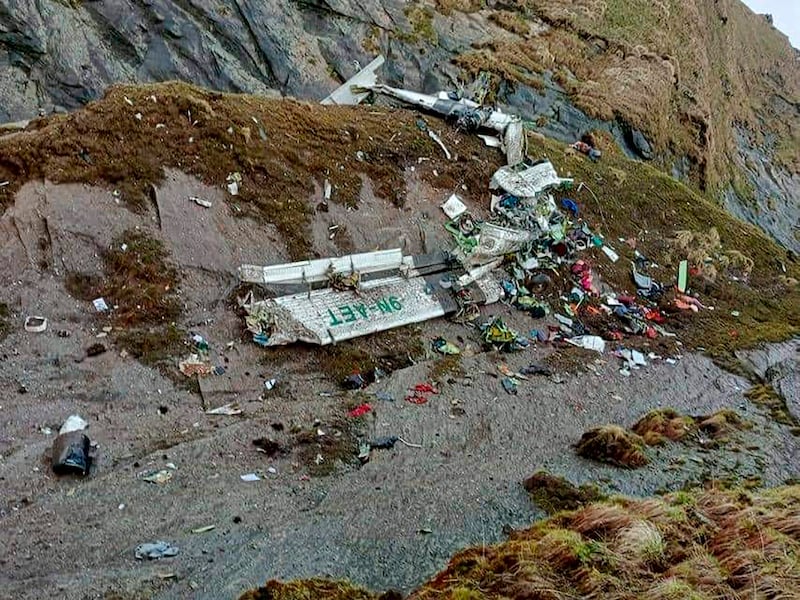 The wreckage of a plane carrying 22 people that disappeared in Nepal's mountains in Mustang district was found scattered on a mountainside. AP Photo