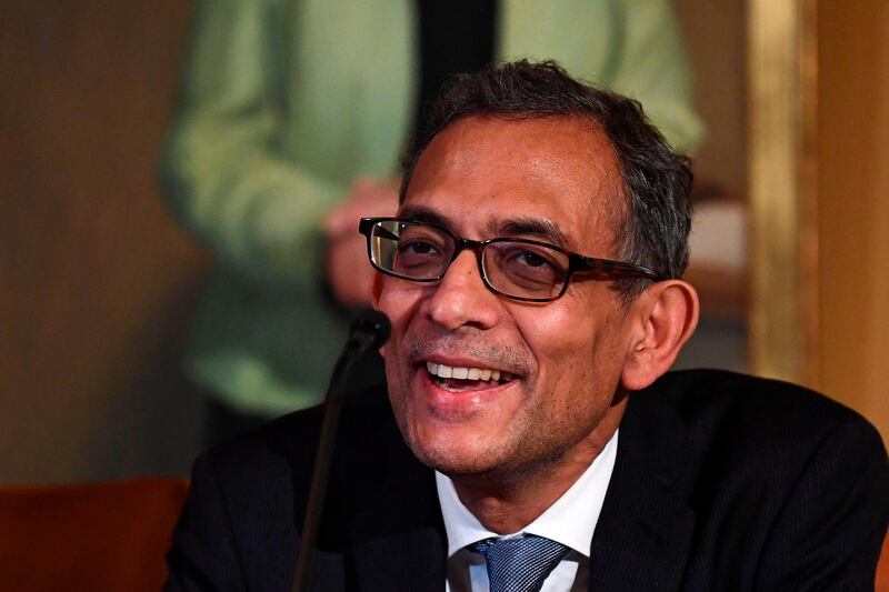 Indian born Abhijit Banerjee, laureate of Prize in Economic Sciences in Memory of Alfred Nobel 2019, speaks during a press conference with the Nobel physics, chemistry and economics laureates at the Royal Swedish Academy of Sciences, on December 7, 2019 in Stockholm, Sweden.  / AFP / Jonathan NACKSTRAND
