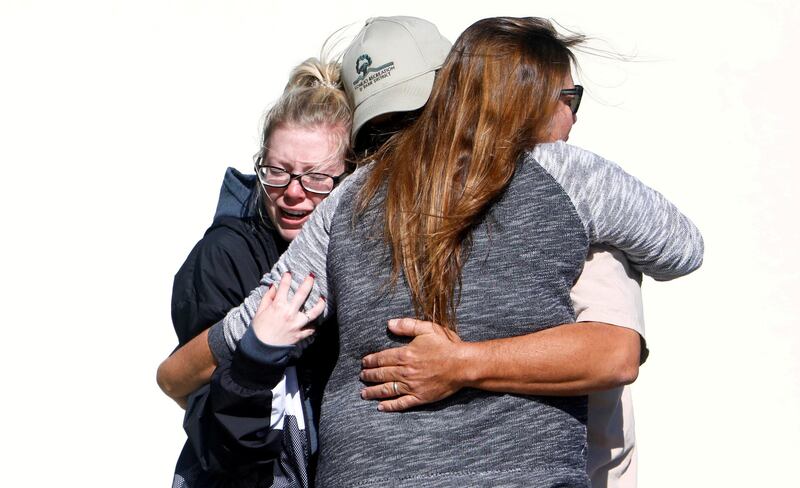 Mourners react outside a reception center for families of victims of a mass shooting in Thousand Oaks, California, on November 8, 2018. Reuters