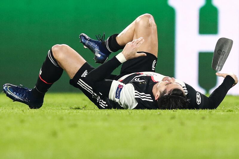 Cristiano Ronaldo lies on the pitch after being tackled during the Champions League match against Atletico Madrid. AFP