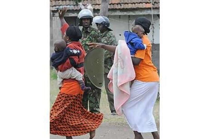 Women and their children resist eviction from Kenyan paramilitary police officers following rent arrears.