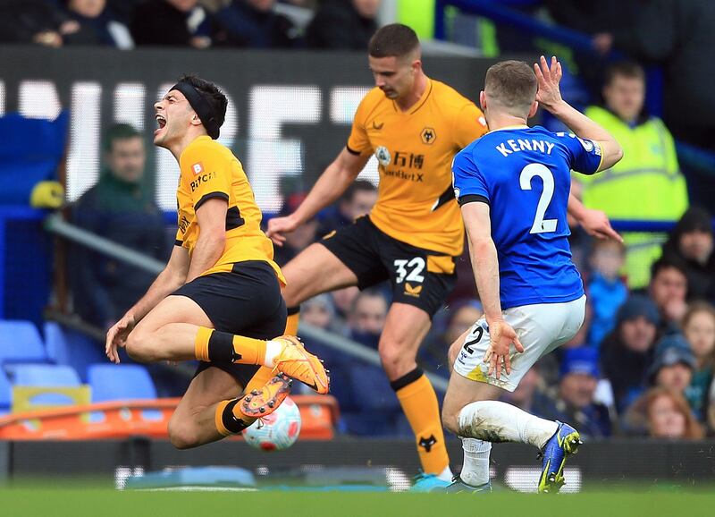 Midfielder Jonjoe Kenny fouls striker Raul Jimenez for his second booking. AFP