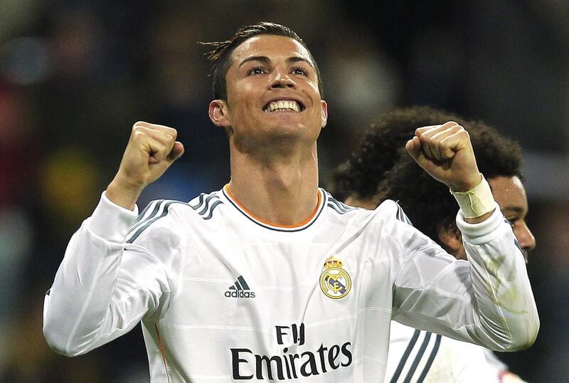 Real Madrid's Cristiano Ronaldo from Portugal celebrates his goal during a Spanish La Liga soccer match between Real Madrid and Celta at the Santiago Bernabeu stadium in Madrid, Spain, Monday, Jan. 6, 2014. (AP Photo/Andres Kudacki)