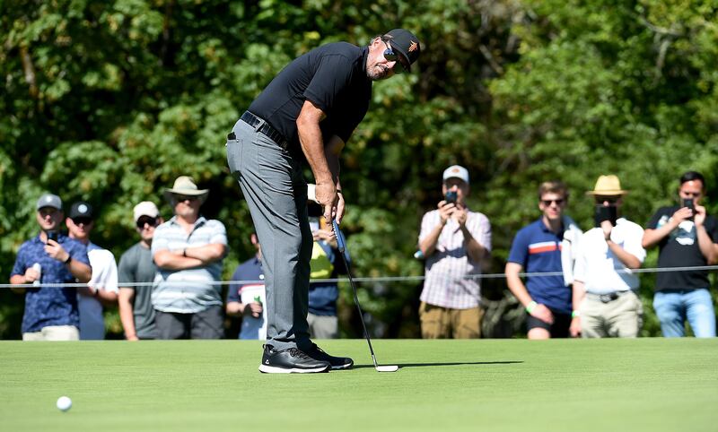 Phil Mickelson putts on the 16th hole during round two of the LIV Golf Invitational - Portland. AFP
