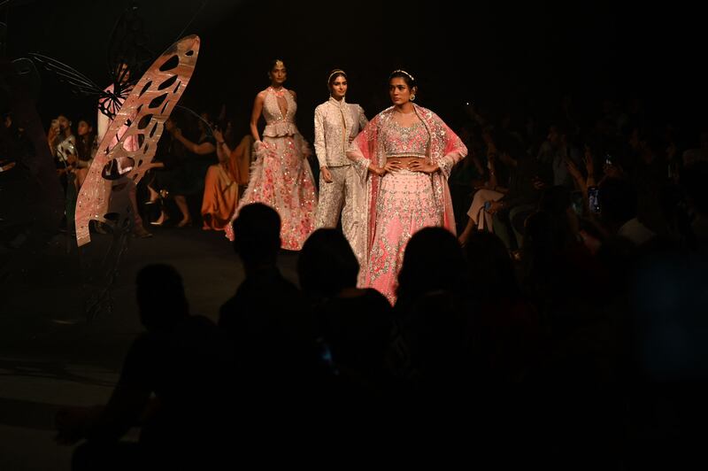 Models present creations by designer Suneet Varma.