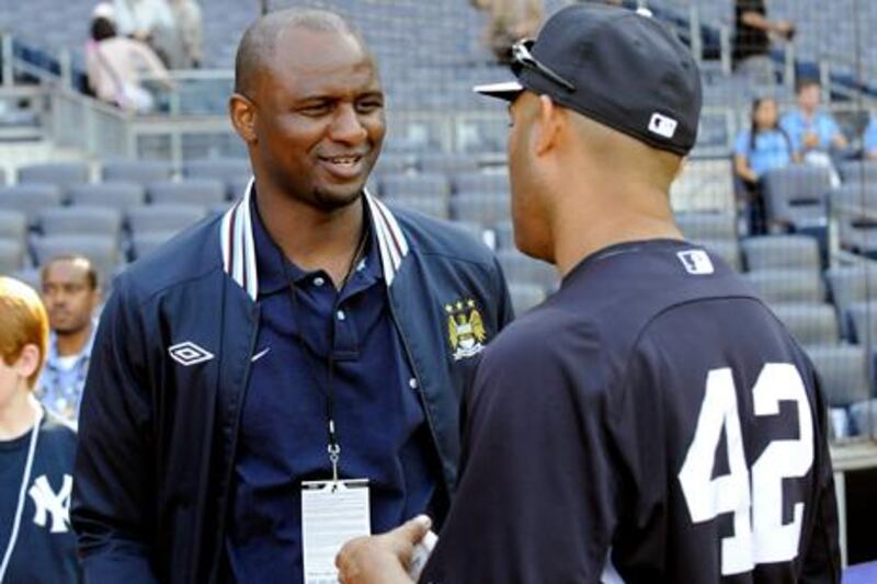 New York Yankees pitcher Mariano Rivera, right, chats with Patrick Vieira of Manchester City FC, during batting practice before the Yankees baseball game against the Toronto Blue Jays Friday, May 17, 2013, at Yankee Stadium in New York. (AP Photo/Bill Kostroun)