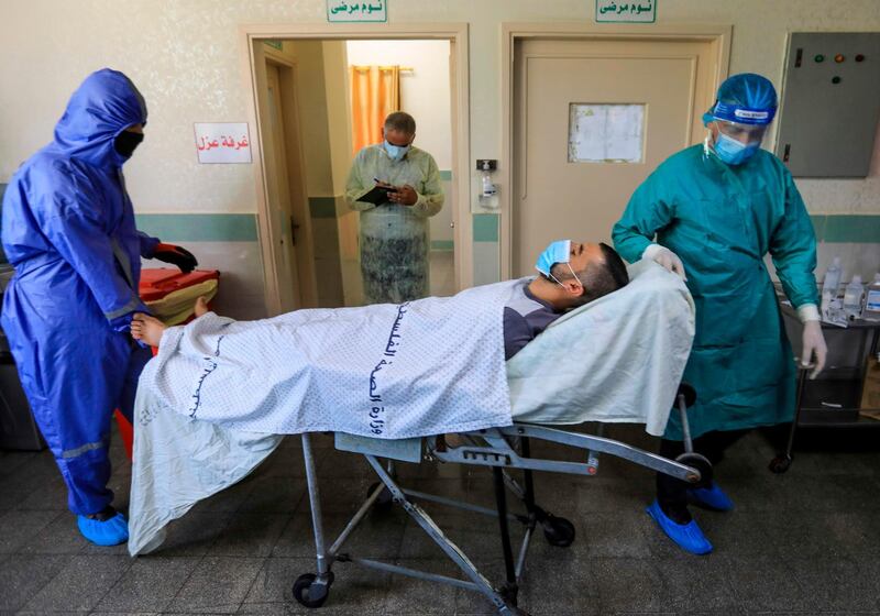 Palestinian medics take part in an exercise to simulate an outbreak of coronavirus in the Gaza Strip.  AFP