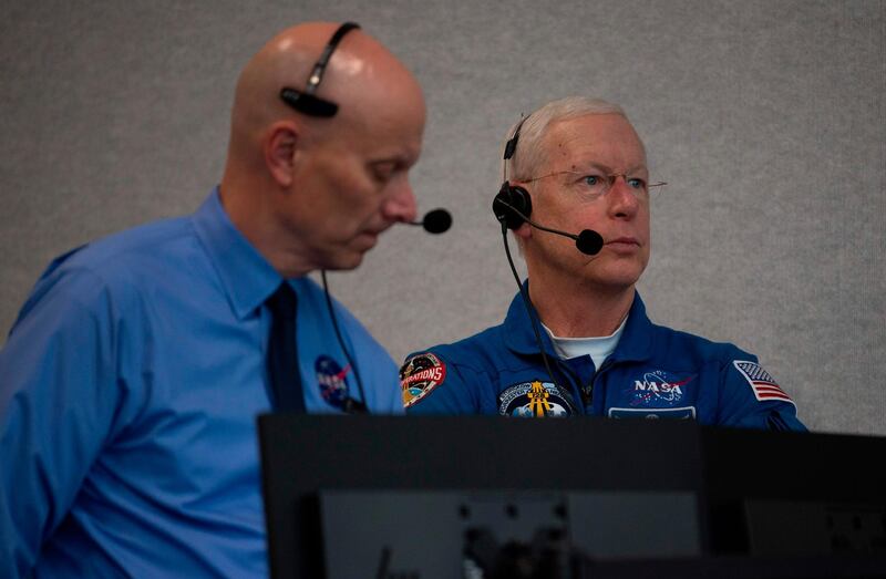 Stephen Koerner, Director of the Flight Operations Directorate at Nasa’s Johnson Space Centre, left, and Pat Forrester, chief of the US space agency's astronaut office, right, monitor the launch countdown.  AFP