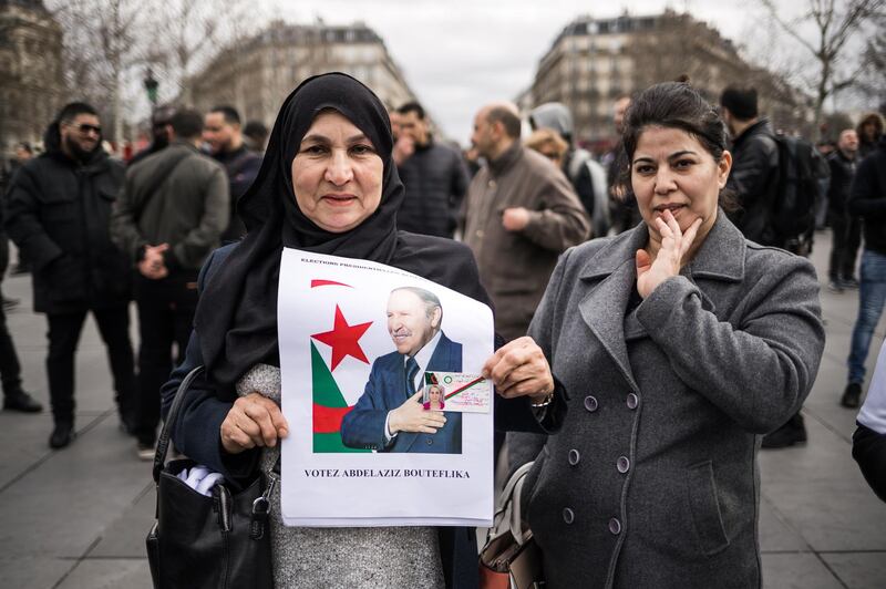 People hold posters of the Algerian president Abdelaziz Bouteflika as a group of Franco-Algerians gather at Republic square to support the fifth term of Bouteflika, in Paris, France. Abdelaziz Bouteflika, has been serving as the president since 1999, has announced on 19 February he will be running for a fifth term in presidential elections scheduled for 18 April 2019.  EPA