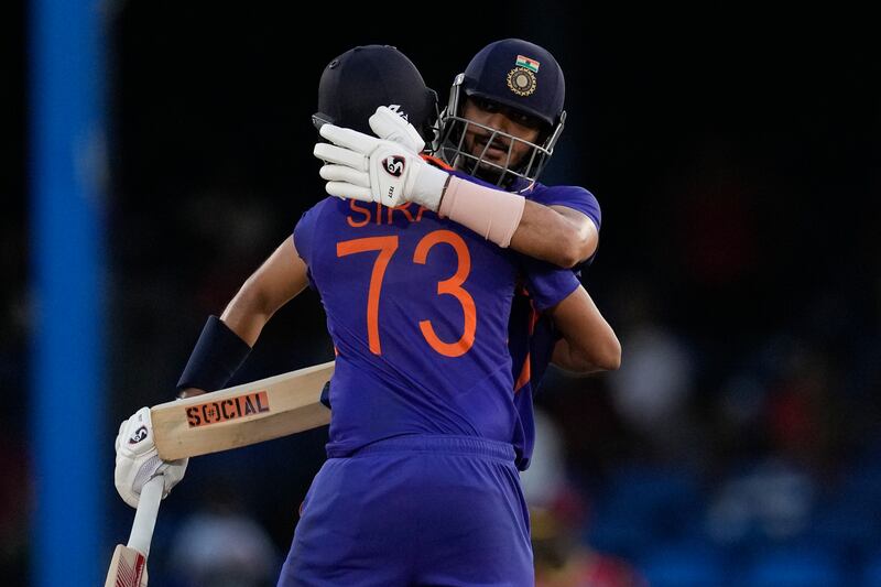 India's Axar Patel celebrates with teammate Mohammed Siraj after hitting a six to win the second ODI cricket match against West Indies at Queen's Park Oval in Port of Spain, Trinidad and Tobago, Sunday, July 24, 2022.  (AP Photo / Ricardo Mazalan)