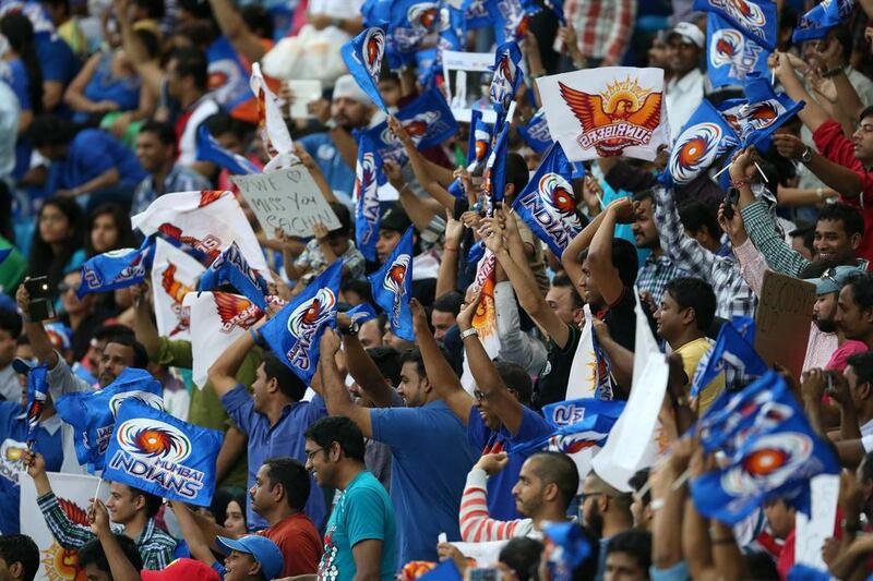 Mumbai Indians and Sunrisers Hyderabad fans wave flags during the IPL match between the two clubs in Dubai on Wednesday. Pawan Singh / The National / April 30, 2014